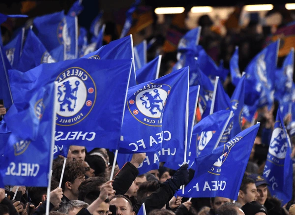 Chelsea fans wave flags in London, UK