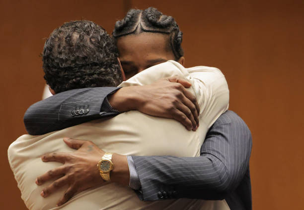 Mayers embraces Tacopina when found not guilty. 